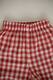 Light trousers with ruffles made from boiled red butter. New collection 