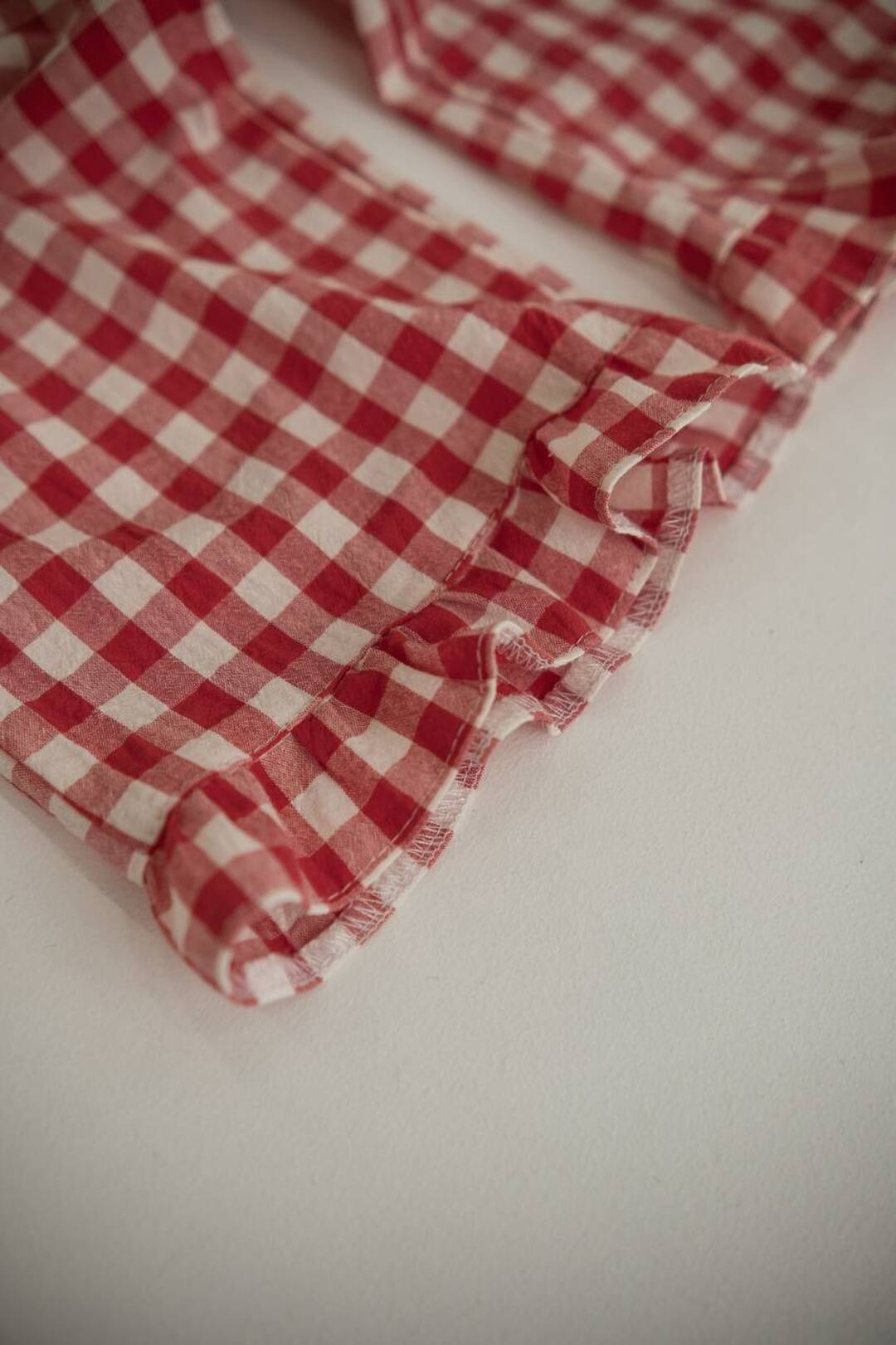 Light trousers with ruffles made from boiled red butter. New collection 