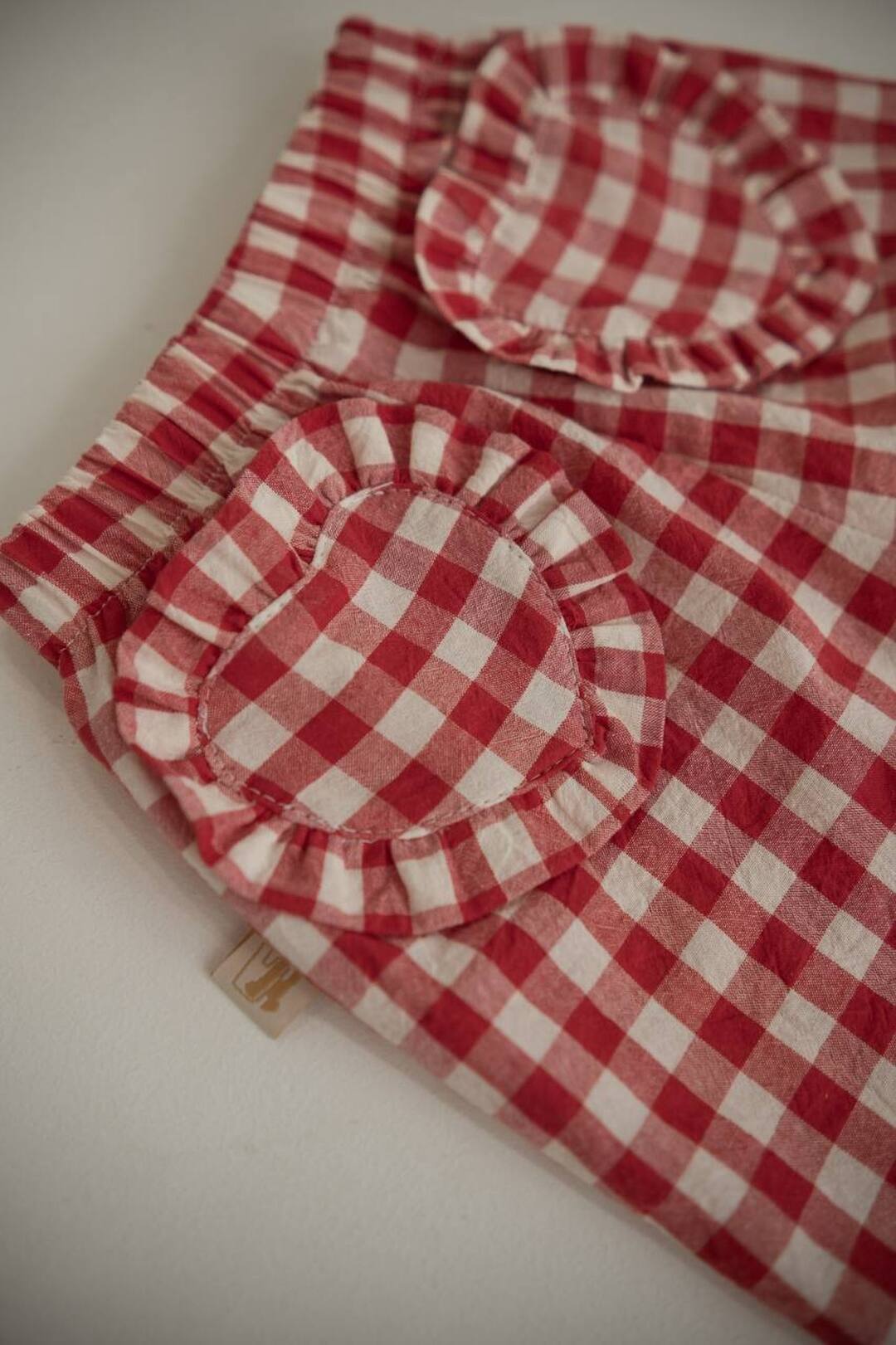 Light trousers with ruffles made from boiled red butter. New collection 