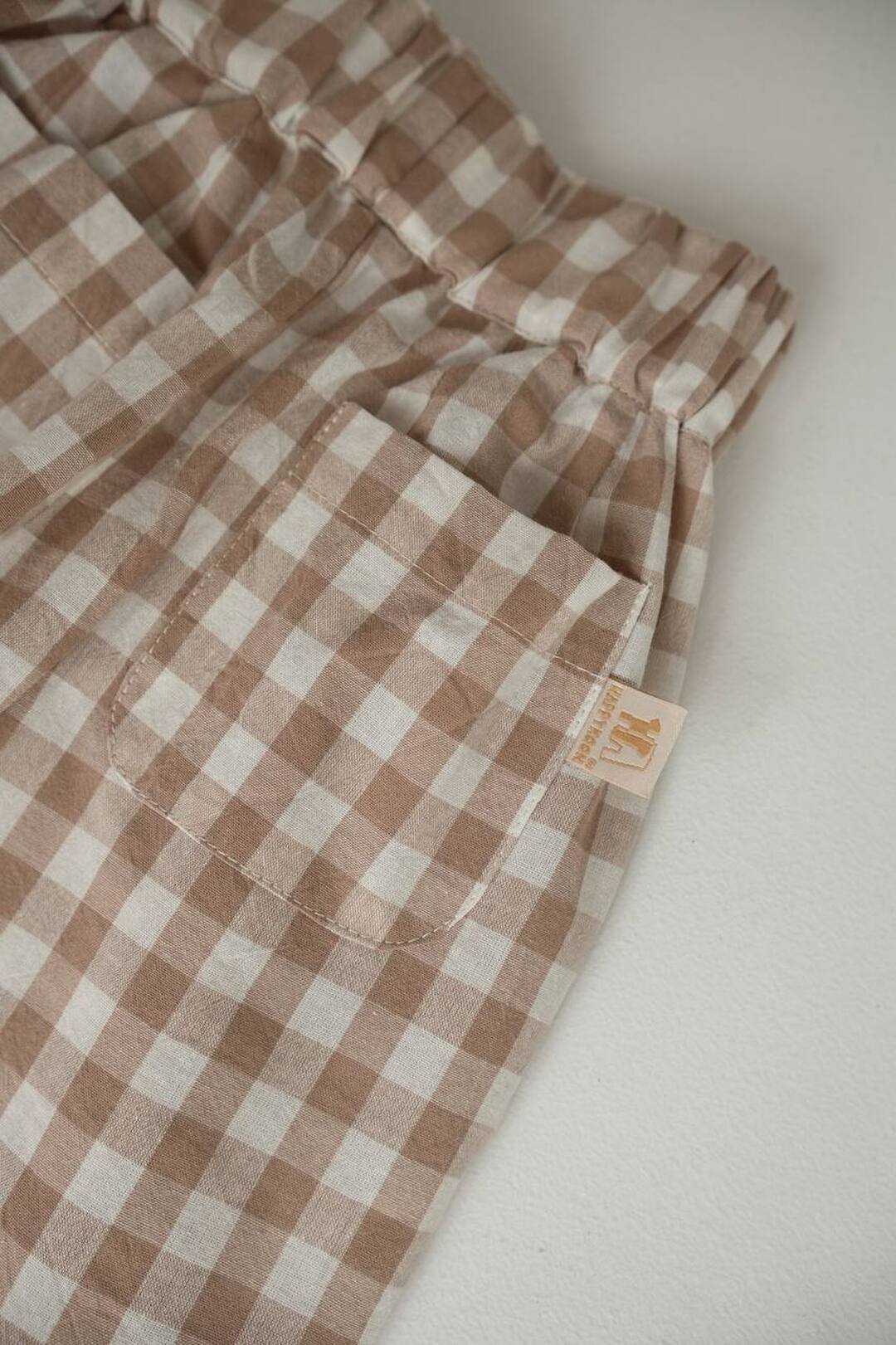 Легкі штанці в клітинку з вареної бавовни Beige. Нова колекція Зображення